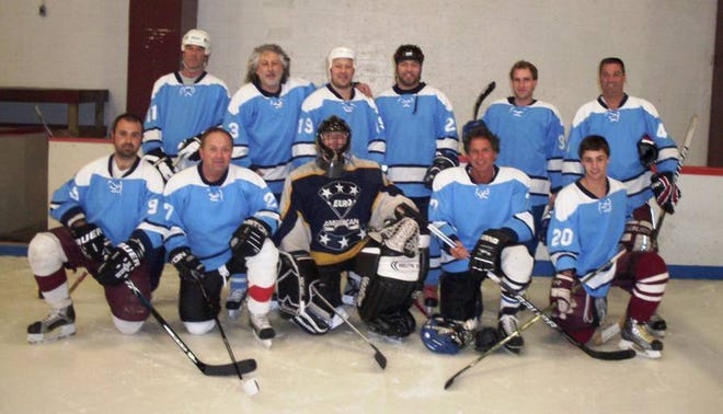Captain Carlos gets together for a team photo at the Father/Son Hockey Tournament. From left to right in the front row, Brendan Chipperini, Brian Chipperini, Anthony Cusumano, Ray Cahoon, Connor Cranston; back row, Mike Horne, Tony Frontiero, Will Frontiero, Tony Frontiero Jr., Kyle Cahoon and Shawn Cranston.