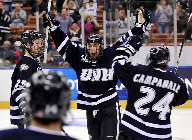 AP photo

UNH forward Kevin Goumas, center, celebrates with teammates after scoring a goal in the third period of NCAA tournament action against Miami in Manchester on Saturday afternoon.