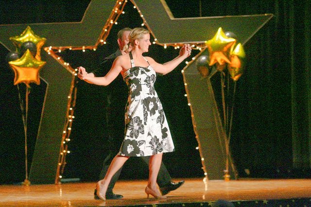 EJ Hersom/Staff photographer 
Norman Carrier and Julia Wagner trot during the Dancing with the Farmington Stars competition Saturday.