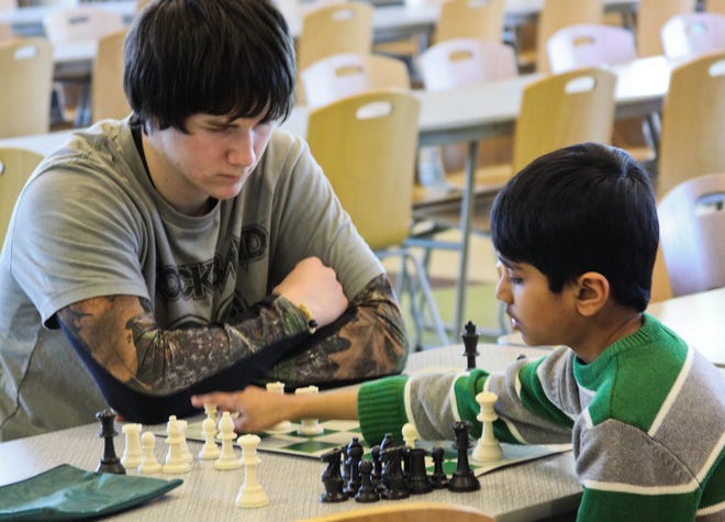 Holland-area youth compete in a chess tournament Saturday at Holland Christian High School.