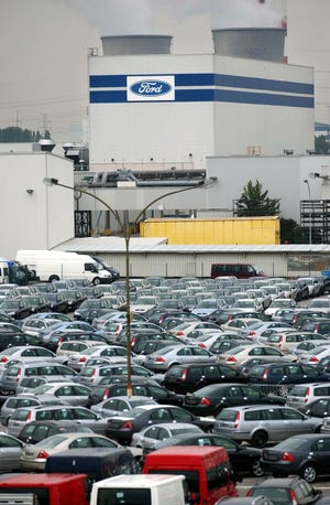 In this Oct. 1, 2003 file photo, a general view of the Ford Motor Company plant in Genk, Belgium, is seen. Ford Motor Co. said Saturday, March 26, 2011, it will idle their plant in Genk for five days, trying to conserve supplies of Japanese parts that could run low following an earthquake and tsunami. Ford spokesman Todd Nissen said the plant will close beginning April 4. The company had planned to idle the plant in May for another reason. But it moved up the date after auto parts suppliers in Japan were damaged by the twin disaster on March 11. (AP Photo/Yves Logghe, File)