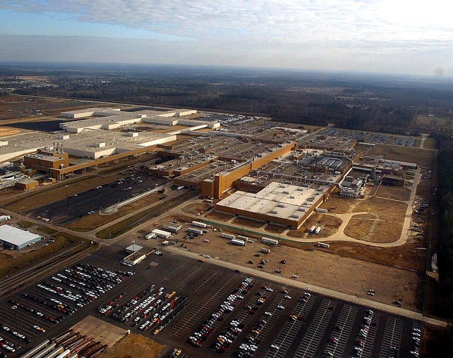 This 2003 aerial file photo shows General Motors Corp.'s Shreveport assembly plant and the surrounding area. The auto industry disruptions triggered by Japan's earthquake and tsunami are about to get worse. When General Motors briefly shut the pickup plant in Shreveport, La., due to a lack of parts, it caused the partial closing of a New York factory that supplies engines for those trucks. (AP Photo/The Shreveport Times, file)