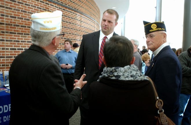 Center- Freshman Congressman Jon Runyan, R-3rd of Mount Laurel, talks to (from left)- Bob Looby of Frencetown (Vietnam Vet, Army '63-'66, NJ State Commander American Legion), Kim Torrone of Westampton (widow of Vietnam Vet Joseph, who served in Army for 36 years), Bob Steelman of Westampton (Vietnam era Vet, Marines '66-'78, Past Commander Post 294 Pemberton), during a veterans' services forum he hosted Monday night at Burlington County College's Enterprise Center in Mount Laurel. (BCT Staff Photo/Pete Picknally).