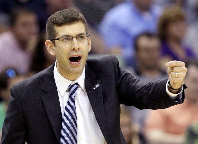 Butler head coach Brad Stevens instructs his team during the first half of the NCAA Southeast regional college basketball championship game against Florida Saturday, March 26, 2011, in New Orleans.