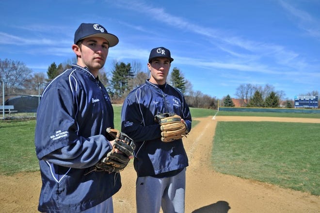Council Rock North baseball players Darren Lauer (left) and Ryan Hartley (right) stand on the their home field at Council Rock North High School.

- Steve Gengler / Staff Photo