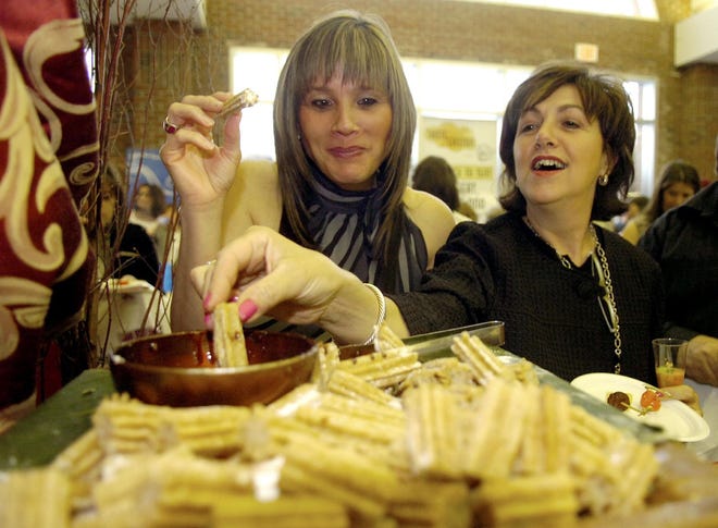 Christine Hale, left, and Cathy Spadea sample churros from Loco Tapas Wine & Bar during the 2008 Taste of Easton.