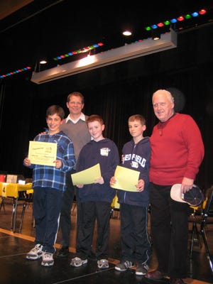 ‘The Paragraph Professionals’ won the grades three through five division. They are, from left, Anthony Tristani, moderator Jim Kuehl, John Kerivan, Jacob Einbinder, and moderator Joe Whit.