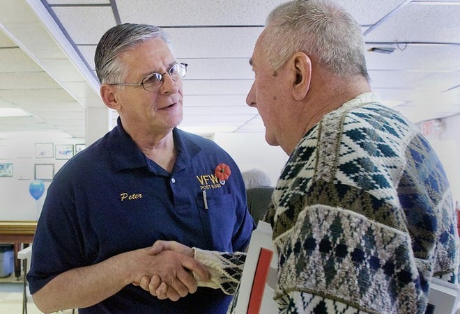 Rev. Peter Hook, a Vietnam veteran from Langhorne talks with Edward Stenderowicz, a Vietnam veteran from Bensalem during the Yardley/Lower Makefield VFW Post 6393's open house on Wednesday in recognition of "Welcome Vietnam Veterans Day". The open house encourages all Vietnam veterans in the area to stop by the post and learn about the services available to them. Kim Weimer/staff photographer
