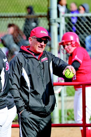 Monmouth College softball coach John Goddard watches on during the Scots JV games with Carl Sandburg College Sunday.