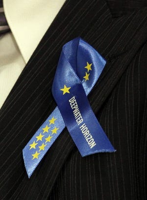 During hearings in October, BP PLC contractor Nick Wilson wore this memorial 
ribbon for the 11 workers killed in the Deepwater Horizon rig explosion.AP 
ARCHIVES