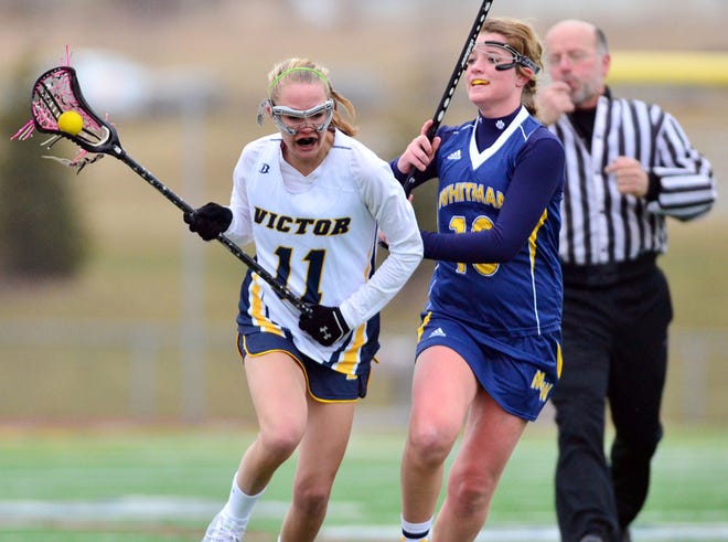 Victor's Melissa Bulman (11) and Marcus Whitman's Molly Gray (10) during a game at Victor High School on Thursday March 31, 2011.