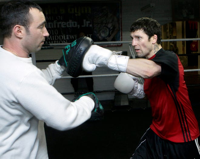 Framingham's Danny O'Connor (right) works out with trainer David Keefe in the ring at Manfredo's Gym in Pawtucket R.I.