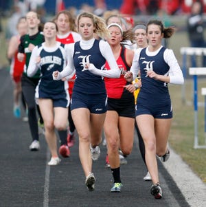 Louisville’s Brooke Mathie (left) leads the pack, including teammate Amanda Oberster (right), in the 1,600 meters at the Fairless Tri-County Invitational on Saturday. Mathie ran a 5:35.52 to take first place, Oberster finished eighth and the Louisville girls rolled to the team championship.