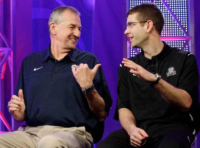 Connecticut head coach Jim Calhoun, left, talks to Butler head coach Brad Stevens prior to taping a television interview for the men's NCAA Final Four college basketball championship game Sunday, April 3, 2011, in Houston. Butler plays UConn in the championship game Monday night.(AP Photo/Eric Gay)