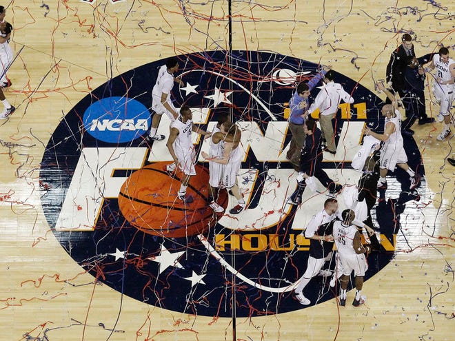 Connecticut celebrate their 53-41 victory over Butler to win the men's NCAA Final Four college basketball championship game Monday in Houston. (AP Photo/David J. Phillip)