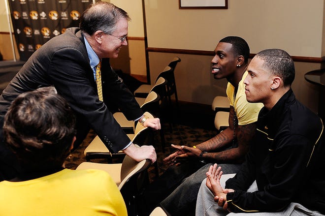 Missouri Chancellor Brady Deaton chats with basketball players Ricardo Ratliffe, center, and Mike Dixon Tuesday before Frank Haith was introduced at Mizzou Arena’s Clinton Club. The players gave Haith positive early reviews.