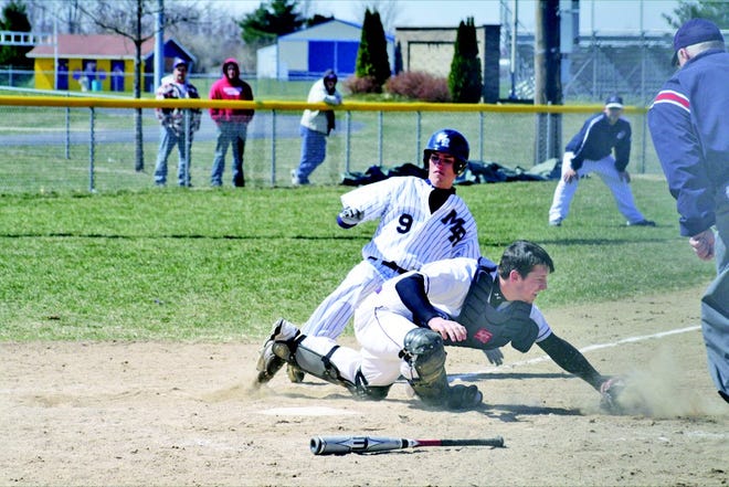 M-R’s Ryan Waller slides home safely during the Titans’ doubleheader at Sherrard Saturday.