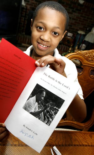 Johnah Lytle with his book "The Battle is the Lord's".