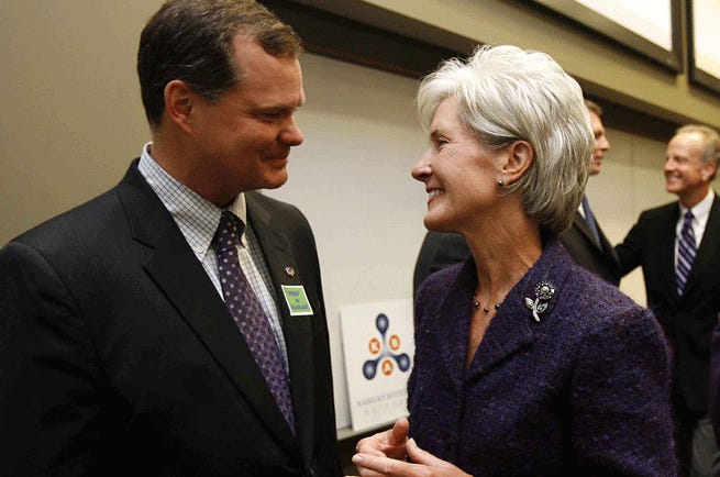 Tom Thorton, chief executive of the Kansas Bioscience Authority, speaks with former Kansas Gov. Kathleen Sebelius. It was announced Tuesday that Johnson County prosecutors are conducting a criminal investigation into the business affairs of the KBA.
