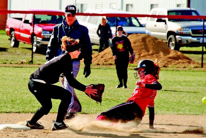 A United runner slides in ahead of a tag (the ball is off frame) against West Prairie Tuesday.