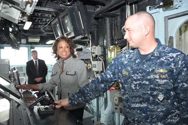 Lt. Kevin Martin gives Florida Lt. Gov. Jennifer Carroll a tour of the bridge of USS Gettysburg during a March 31 visit to Naval Station Mayport. Carroll was guest speaker at Mayport's Women's History Observance at Ocean Breeze Conference Center before touring the base and ship.