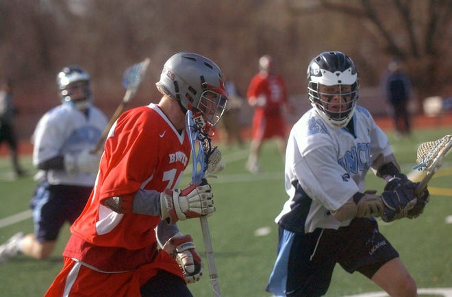 Eastridge's Mike Morillaro, right, keeps up with Canandaigua's Mark Greer.