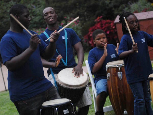 From left to right, Dreams Center for Arts Education student Quae-Shawn Washington, 16, drum instructor Cheick Sissoko, and students Adam Chandler, 11, and Domeana Nixon, 10, play during the kick-off for the 2007 Cape Fear Area United Way Campaign on Thursday, September13, 2007.