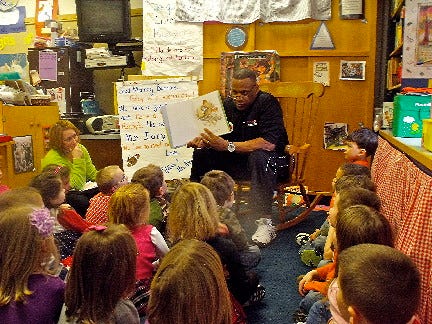 Tony Collins reads to Penn Yan Elementary Pre-K students.