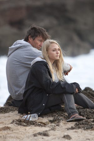 In this film publicity image released by TriStar Pictures, Dennis Quaid, and AnnaSophia Robb are shown in a scene from "Soul Surfer."