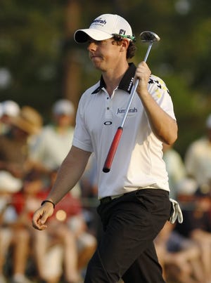 Rory McIlroy of Northern Ireland walks off the green after a par on the 18th hole on Saturday in Augusta, Ga.