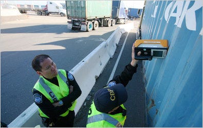 Customs and Border Protection officers check containers for radiation at the Port of Oakland.