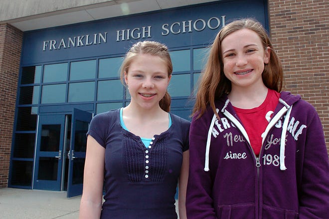 Natalie Loureiro, 15, left, and Samantha Rondeau, 14, both students at Franklin High School, are members of Teenangels, a group of teenagers trying to prevent distractions while driving.