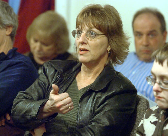 Middleboro resident Donna Grant questions sick leave bonuses paid to utility employees during the meeting Tuesday night.