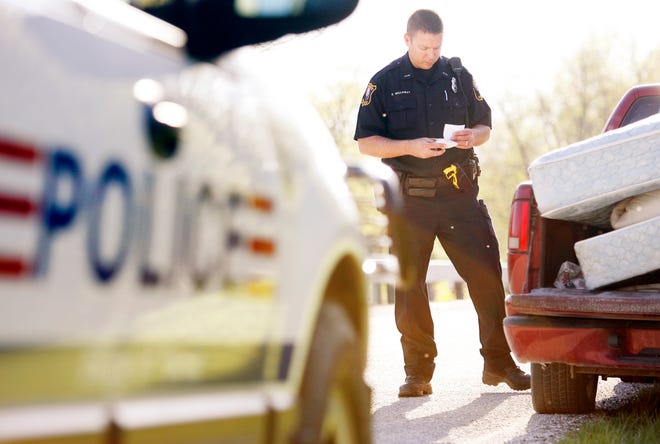 Pawnee Police Officer Darrek Galloway makes a traffic stop on the outskirts of Pawnee Tuesday, April 12, 2011. The police department negotiated its first three-year union contract in 2009.