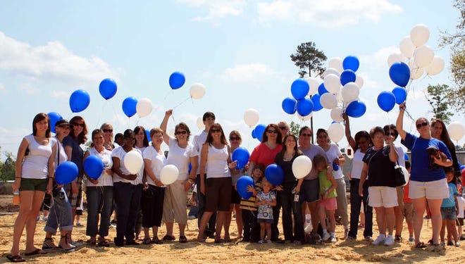 More than 150 teachers, parents and children from Richmond Hill Montessori School released 150 balloons in honor of the Week of the Child in the balloon launch last Saturday. The launch was held at the school's newly cleared site on U.S. 17, soon to be the future home of the Montessori Preschool.