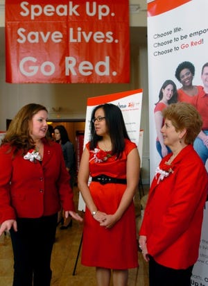 Survivors (from left) Sharon Maffei of Evesham, Katerina Kotzias of Edgewater Park and Celeste Masny of Evesham chat during the American Heart Association's fifth annual Go Red for Women luncheon fundraiser at The Merion in Cinnaminson on Wednesday.