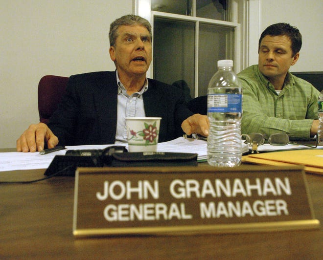 John Granahan, left, general manager of the  Middleboro Gas & Electric Commission, answers a question from the public. Next to him is board member Joseph Ranahan.