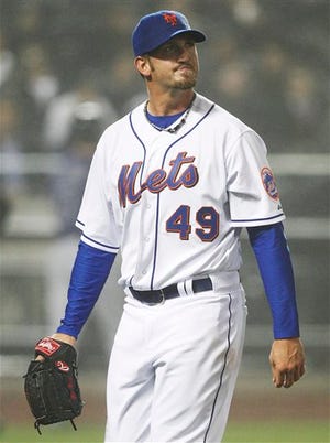 New York Mets starting pitcher Jonathon Niese leaves the field during the fifth inning of a baseball game against the Colorado Rockies, Wednesday, April 13, 2011, at CitiField in New York. The Mets lost the game 5-4. (AP Photo/Frank Franklin II)r