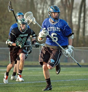 Scituate's Dave Mavillia (6) brings the ball down the field during boys lacrosse game against Marshfield, at the Chowda CupTournament at Cohasset High School, Thursday, April 14, 2011.