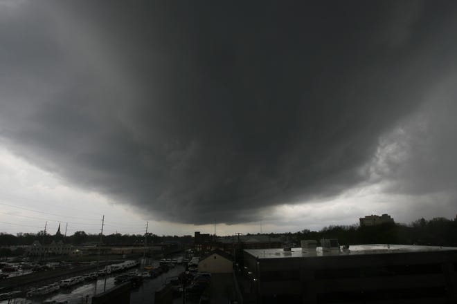 The storm hangs over downtown Springfield just before 6 p.m.