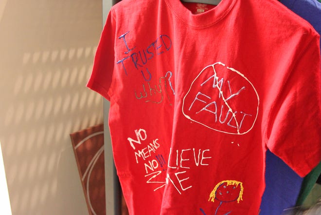 Sexual abuse victims make shirts expressing their feelings as part of the therapy offered through victim services.