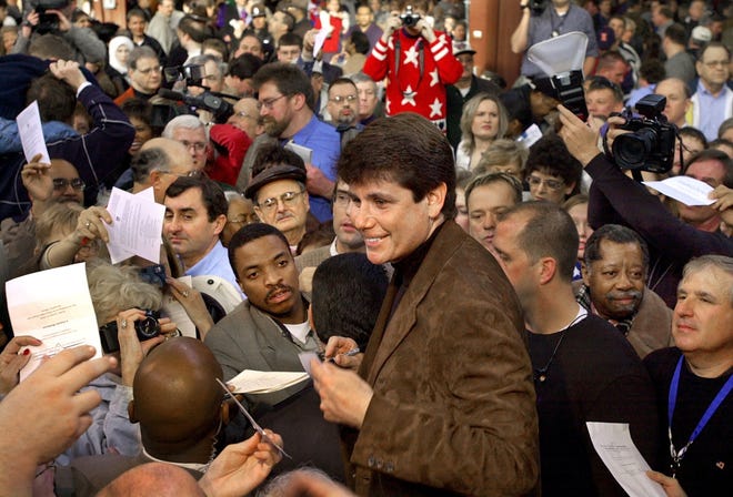 Rod Blagojevich signs autographs amid a sea of supporters Jan. 12, 2003, in Springfield during an inauguration barbecue at the State Fairgrounds. Blagojevich's first inauguration cost about $1.5 million. The second was about a third of that.