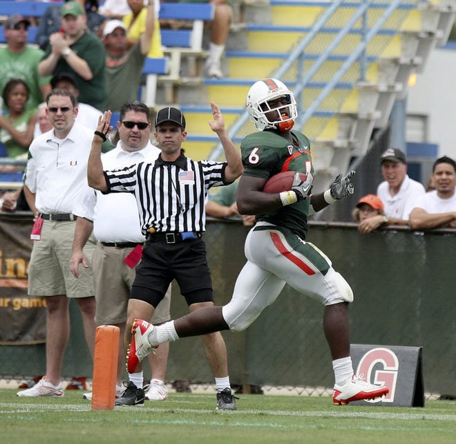 Miami green team's Lamar Miler scores a touchdown during the third quarter of the Hurricanes' spring game on Saturday at Lockhart Stadium in Fort Lauderdale.