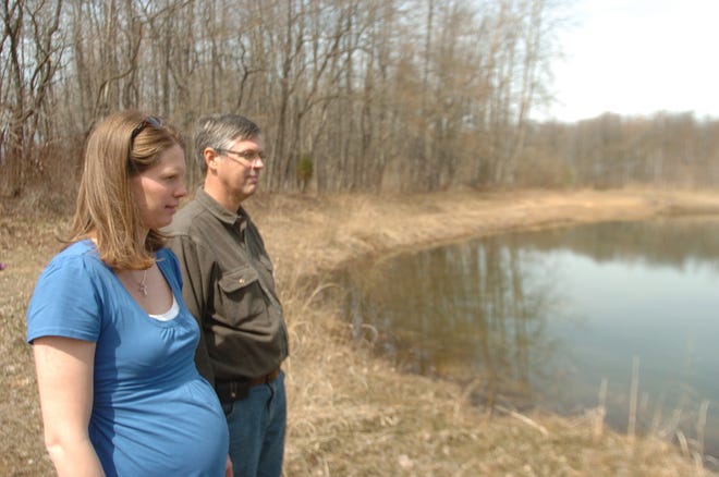 Dennis R.J. Geppert/The Holland Sentinel Sarah Westenbroek and her uncle Jack Vander Meulen look over a pond on the property that used to belong to Westenbroek's father before he died in a plane crash in 1985. The property is now owned by the Outdoor Discovery Center, who is re-dedocating the property to Westenbroek's family members who died in the plane crash.