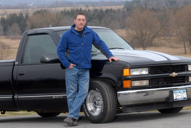 Ron Draper, 40, of Poland photographed in front of his 1997 Chevrolet C1500 that runs on biodiesel fuel - modified vegetable oil, Sunday, April 10, 2011 in Poland. The truck uses a Mercedes turbo engine.