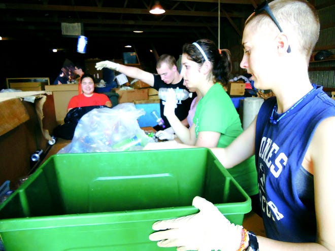 Monmouth College students spend a day recycling.