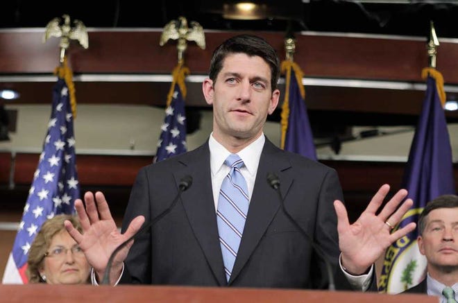 FILE - In this April 13, 2011 file photo, House Budget Committee Chairman Paul Ryan, R-Wis. gestures during a news conference at the Capitol in Washington. Standard & Poor's Ratings Service downgraded its outlook Monday on the United States' sovereign debt, expressing unprecedented doubts over the ability of Washington to bring the massive federal budget deficits under control in the next three years. He is flanked by Rep. Diane Black, R-Tenn., left, and Rep. Jeb Hensarling, R-Texas, right. (AP Photo/J. Scott Applewhite)