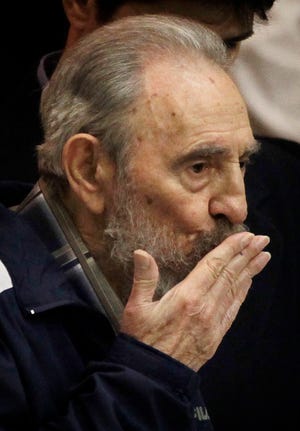 Fidel Castro blows a kiss to Cuban Communist Party members after making a surprise appearance at the 6th Congress in Havana, Cuba, Tuesday April 19, 2011. Cuba's President Raul Castro was named first secretary of Cuba's Communist Party on Tuesday, with Fidel not included in the leadership for the first time since the party's creation 46 years ago. Despite raising hopes during the gathering that a new generation of leaders was poised to take up important positions, Raul announced that Jose Ramon Machado Ventura, an 80-year-old longtime confidante, would be his No. 2. (AP Photo/Javier Galeano)