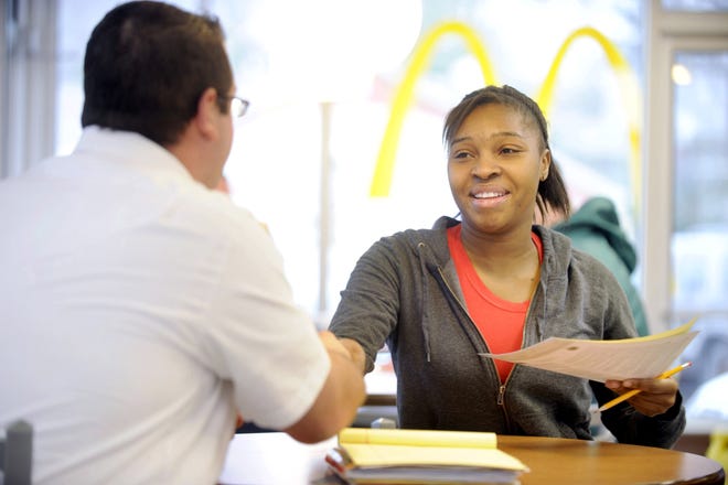 D'Nisha Pigford (right) of Canton interviews for a job with Robert Dixon, an area supervisor, at McDonald's Restaurant in Perry Township Tuesday during McDonald's National Hiring Day.