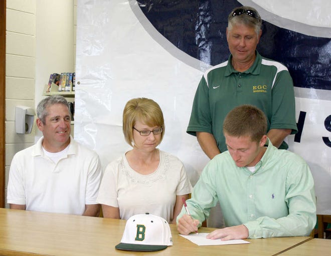 TOP: Austin Denney is seen with his parents, Bill and Pam Denney, and an East Georgia College representative.
